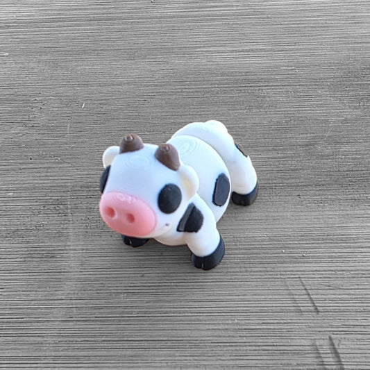 Meet the Mini Cow, your new tiny farm friend!  Perfect for adding a playful twist to your desk, shelf, or collection. Made in Australia by Chaos3DPrinting.