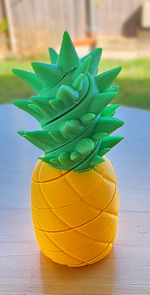 Pineapple-shaped container that spirals apart. 3D printed pineapple fidget toy thats made in Australian by Chaos 3D Printing.
