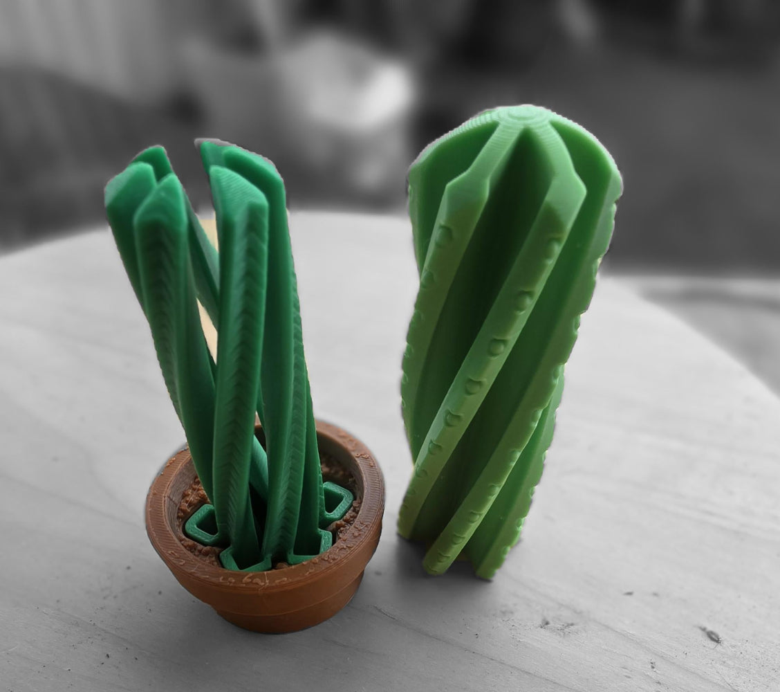 Green cactus-shaped object in a brown pot. Twisting fidget 3d toy made by Chaos 3D Printing in Australia.